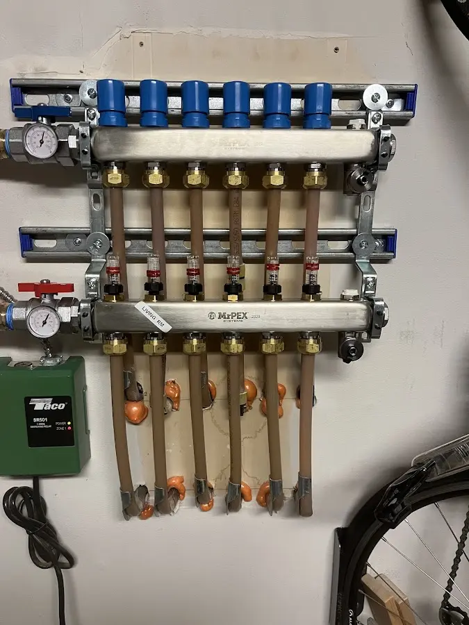 Plumber performing Water Heater Repair at a residential property in Ralston